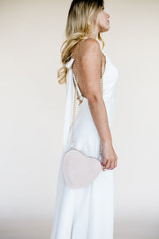 Heart shaped bridal clutch bag in blush pink suede