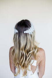 Feather shaped bridal hair accessory headpiece with white opal Swarovski crystals