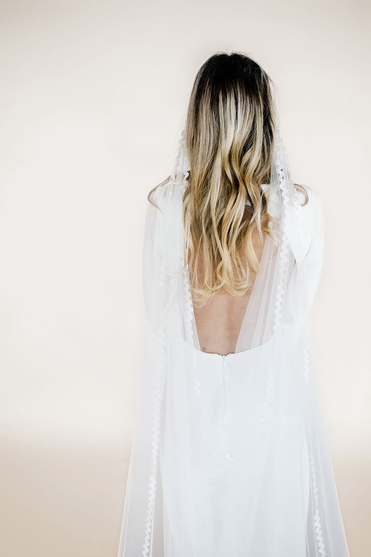 Modern wedding veil with lace trim edging and drape cowl back