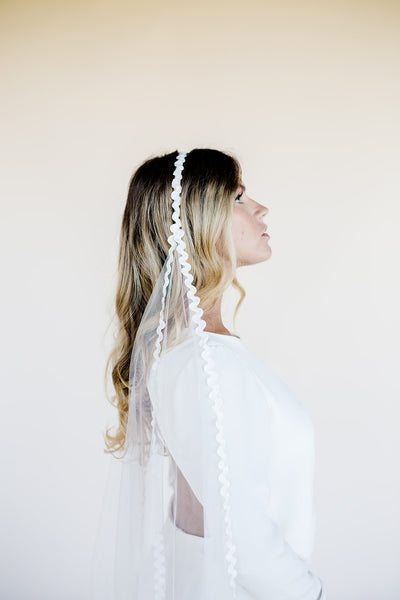 Modern wedding veil with lace trim edging and drape cowl back