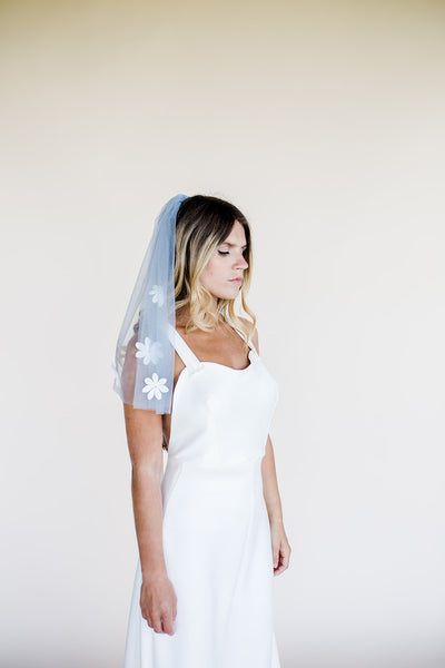 Short blue blusher wedding veil with flower applique daisy