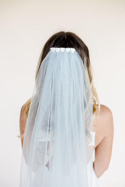 Waist length blue wedding veil with mother of pearl heart embellishment